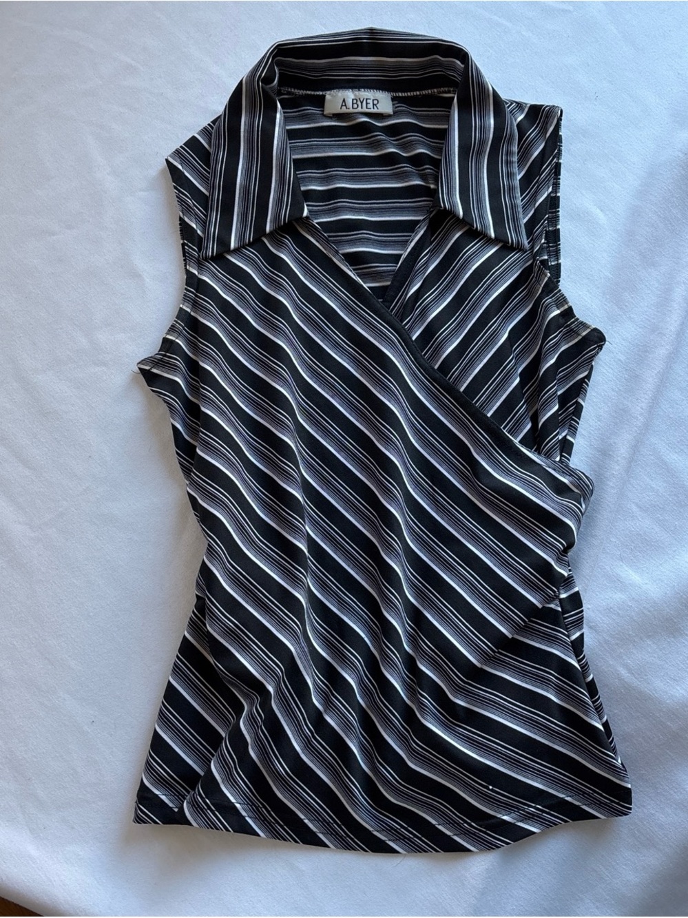 A. Byer Black & White Diagonal Stripe Sleeveless Wrap Blouse